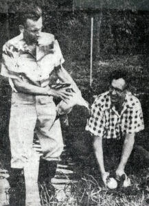Paul Breese & Director of Fish & Game Vernon Brock inspecting waterfowl, 1950