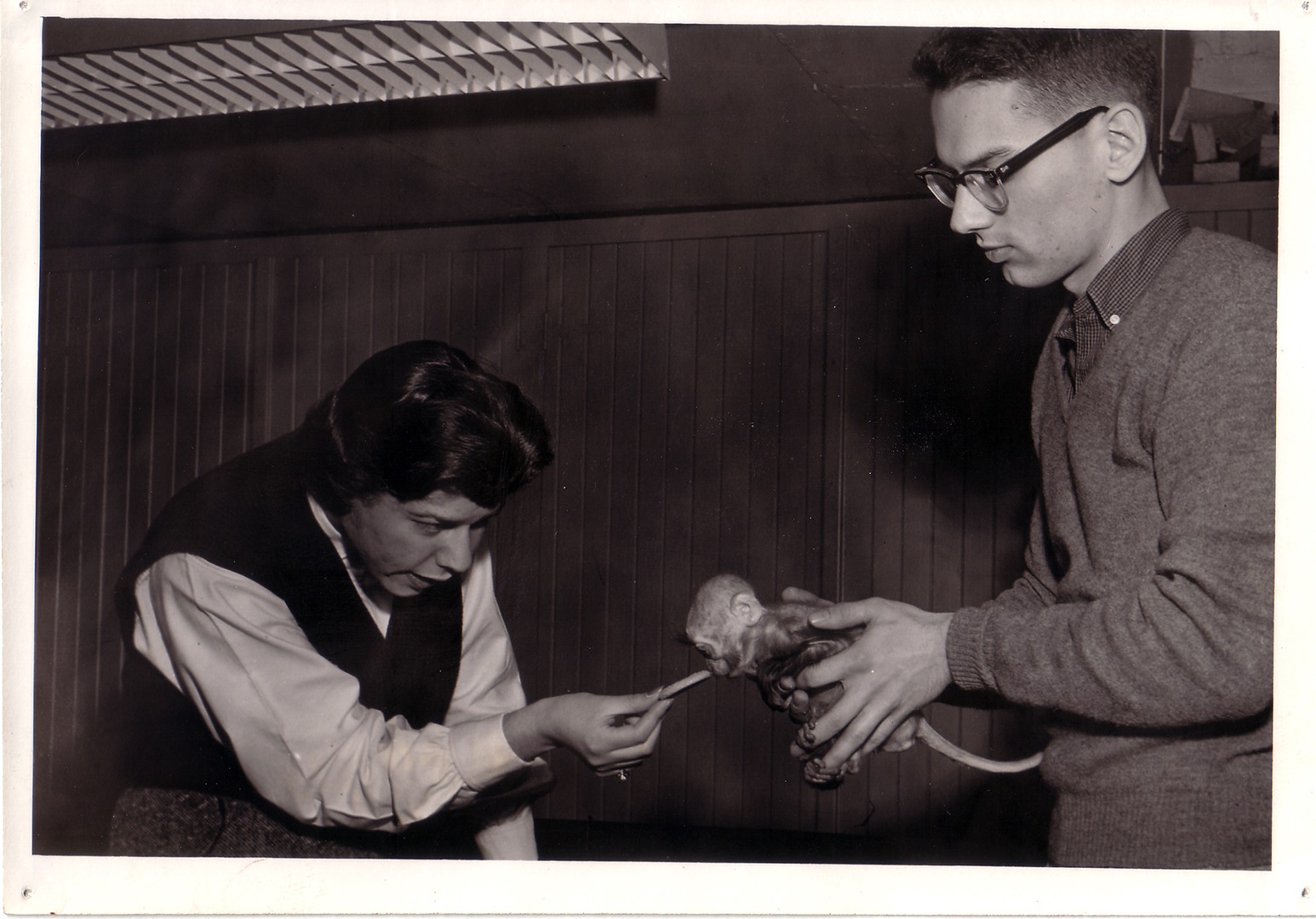 Zoologist Don Nickon with baby monkey